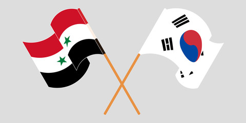 Naklejka premium Crossed and waving flags of Syria and South Korea