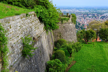 Fototapeta na wymiar The castle walls of the castle of Di San Vigilio, view of the city of Bergamo. Castle di San Vigilio is a public place. Italy