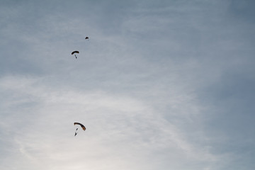 Lone of Sky Diver Descending with Parachutes Deployed