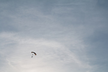 Team of Sky Divers Descending with Parachutes Deployed