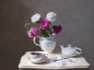 Still life with cup of tea and aster flowers