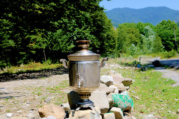 Vintage metal copper tea samovar. Samovar side view. Retro soot grunge tea samovar. Ancient Azerbaijan samovar. A device for making tea.