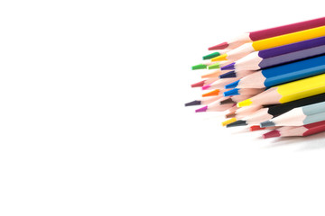 Colored sharpened pencils on a white background. Copy space, selective focus.