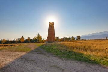 Burana tower, tall and large minaret in the ruins of the ancient site of Balasagun, in Kyrgyzstan.