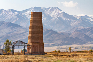 Burana tower, tall and large minaret in the ruins of the ancient site of Balasagun, in Kyrgyzstan.