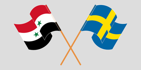 Crossed and waving flags of Syria and Sweden