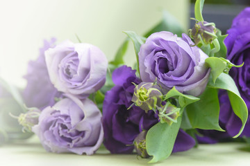Beautiful bouquet of purple flowers on a green background. Flower arrangement for your beloved.