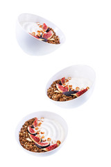 Greek yogurt chocolate nuts oatmeal granola with figs on a white isolated background