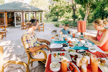 Family enjoying meal in garden