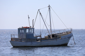 Naklejka na ściany i meble A fishing boat alone in the Baltic Sea off the island of Saaremaa in Estonia