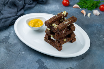 fried Garlic croutons on grey table