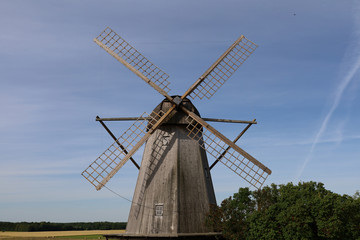 Obraz na płótnie Canvas An old wooden windmill on the island of Saaremaa in Estonia