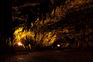 Tourists observe the Drogarati Cave on Cephalonia, Greece