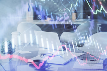 Double exposure of stock market graph drawing and office interior background. Concept of financial analysis.