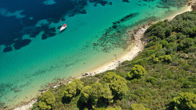 Aerial drone photo of secluded paradise sandy bay a safe anchorage for sail boats and yachts with turquoise bay, Ithaki or Ithaca island, Ionian, Greece