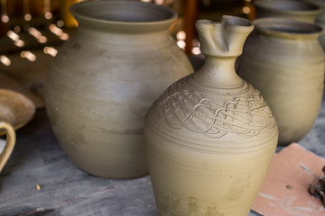 Fototapeta na wymiar unburned clay vessels on table