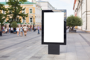 Outdoor mock up of a blank information poster; an empty vertical street banner template; billboard placeholder mockup on a city  alleyway outdoors with people