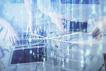 Double exposure of man and woman working together and data theme hologram drawing. Computer background. Top View.