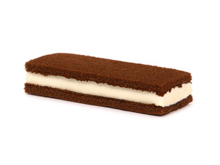 Brownie cake sandwich filled with milk cream isolated on white