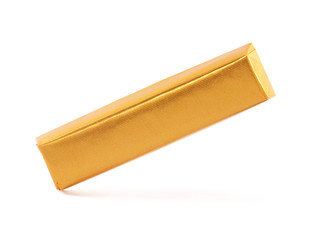 Chocolate bar wrapped in golden aluminum foil isolated on white