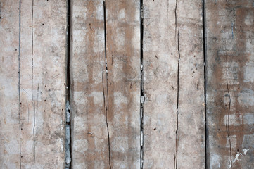 Old dirty wooden planks. Wall during the renovation of the apartment.