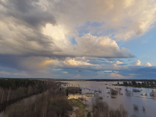 Obraz premium Storm clouds over flooded fields in the Vychegda river valley, Komi Republic, Russia.