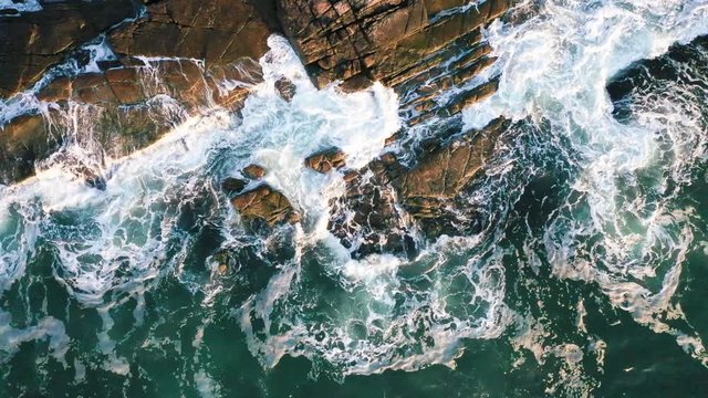 Stationary Overhead Aerial Drone Clip Of Ocean Waves On Rocky Shore