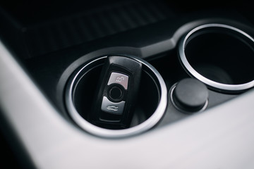 Car ignition key at the cup holder