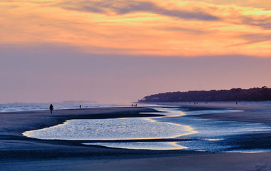 Enjoying stroll on Hilton Island beach during muted, winter sunset
