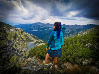 Naklejka premium Girl in the mountains