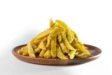Potato wedges with oregano on wooden plate. White background.