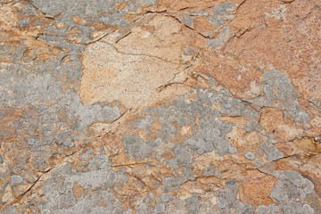 茶色がかった色の岩石の表面をクローズアップ	