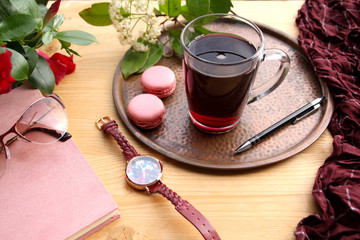 french pasta cake on a copper tray, pomegranate, cherry juice, fruit drink in a glass mug, women's watches, glasses, daily planner in garden, concept lifestyle, breakfast on summer terrace, seasonal