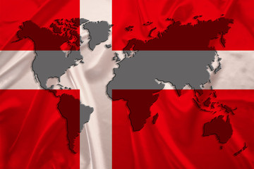 silhouette of a world map on the silk national flag of the modern state of Denmark with beautiful folds, concept of tourism, travel, emigration, global business