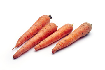 Heap of fresh raw carrots isolated on white background