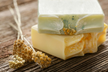 Handmade soap with herbal ingredients around. Homemade toxic-free natural organic cosmetic.