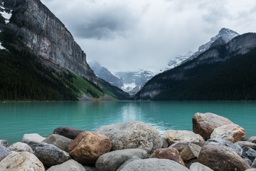 Canadian landscape and Turquoise Water at Lake Louise, Alberta, Canada. Majestic Rocky Mountains in Banff National Park. Tourism and Famous Holiday Destination. Calm and Still Water from a Glacier