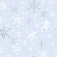 White snowflakes seamless pattern. Snow crystals on light blue background. Great for winter fabric, textile, Christmas wrapping paper, scrapbooking. Surface pattern vector design.