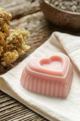 Heart-shaped pink handmade soap with natural ingredients.  Homemade toxic-free natural organic soap bar. 