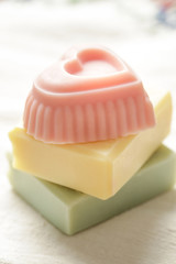 Pastel colored handmade soap bars, close up. Homemade toxic-free natural organic cosmetic.