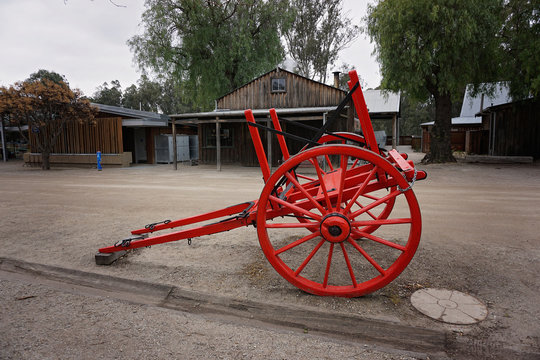 Old red vintage cart of yesteryear.