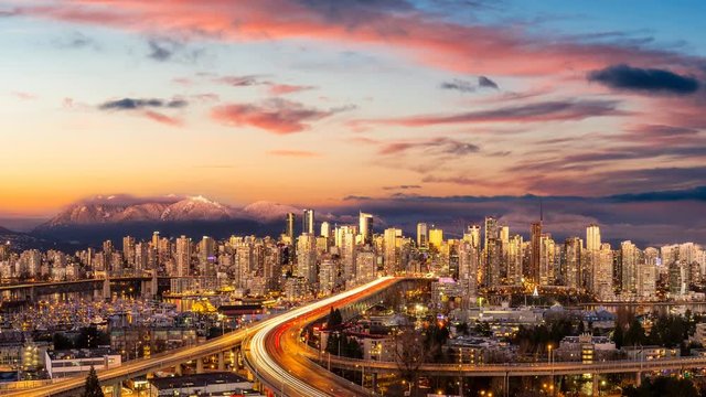 Cinemagraph Continuous Loop Animation. Aerial Panoramic view of Downtown Vancouver, Cambie Bridge, and False Creek. Picture taken during a cloudy sunset. Colorful sky Overlay.