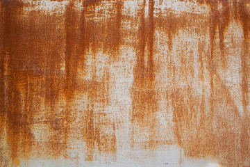 Rusty metal surface with peeling white paint, scratches and scuffs. Texture.