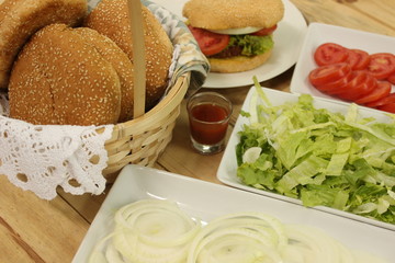 Hamburguer and elements for party with tomatoes and lettuce