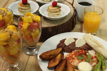 Traditional breakfast with pancakes and fruits