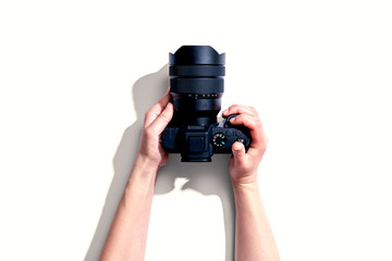 Person holding a SLR camera from above
