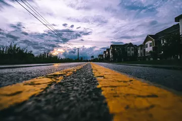 Fototapeten sunset on the road © Jimmy