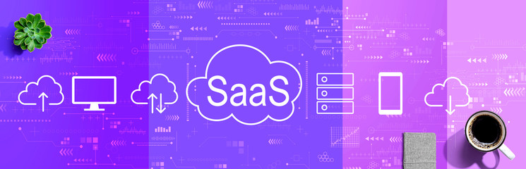 SaaS - software as a service concept with a cup of coffee and a notebook