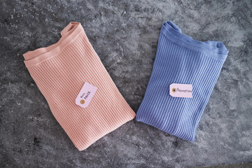 shopping concept, knit jumpers in alternative colours with Full Price vs Promotion price tags