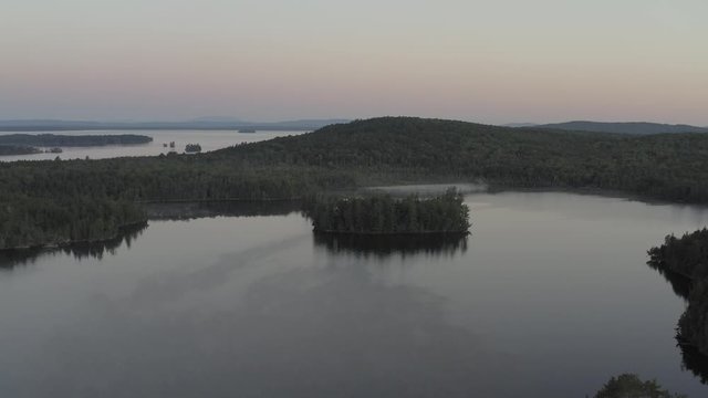 Wide aerial view over Prong Pond Summer wilderness sunrise 